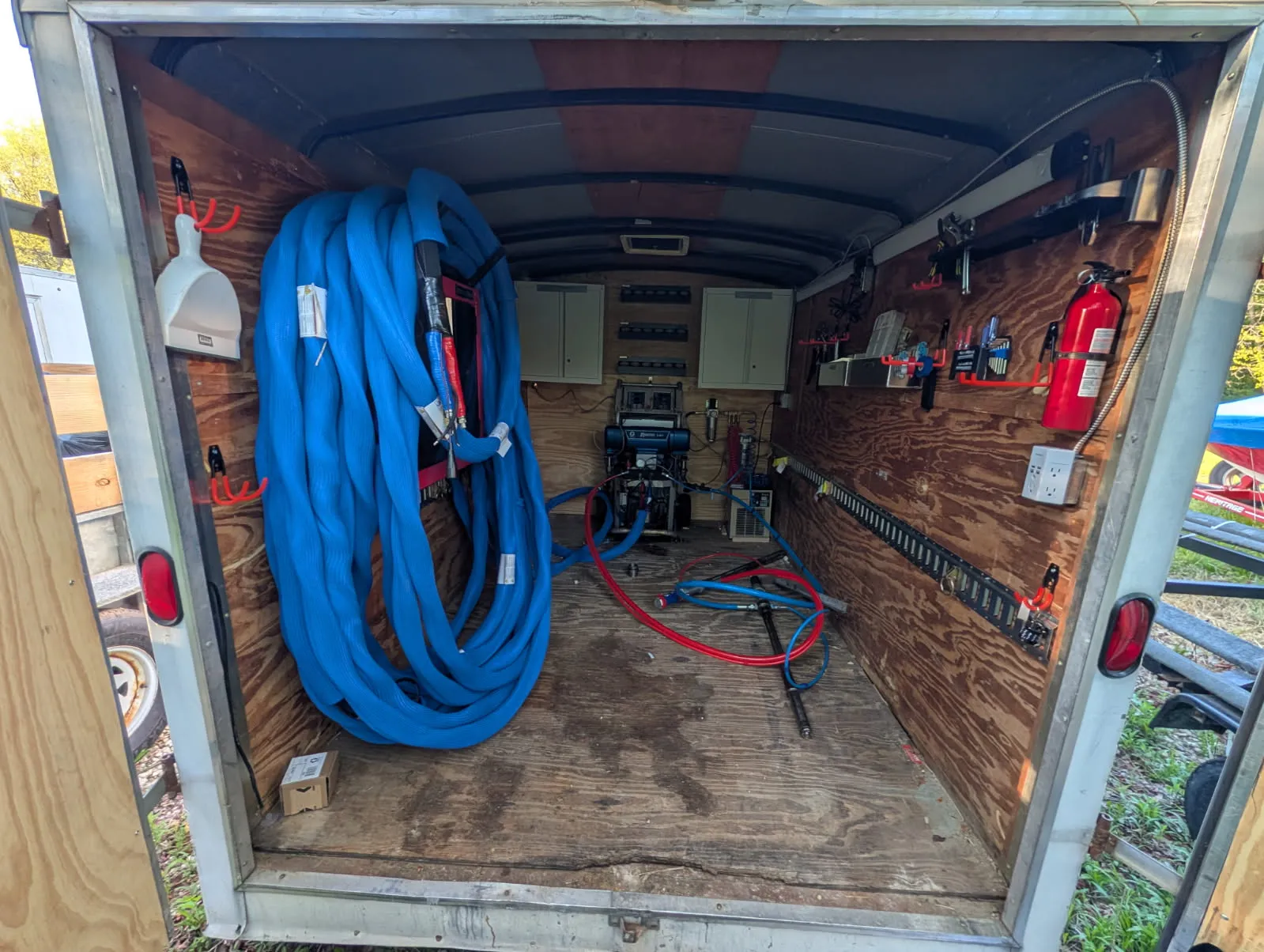 Spray foam rig rental Kokomo equipment trailer and hose setup