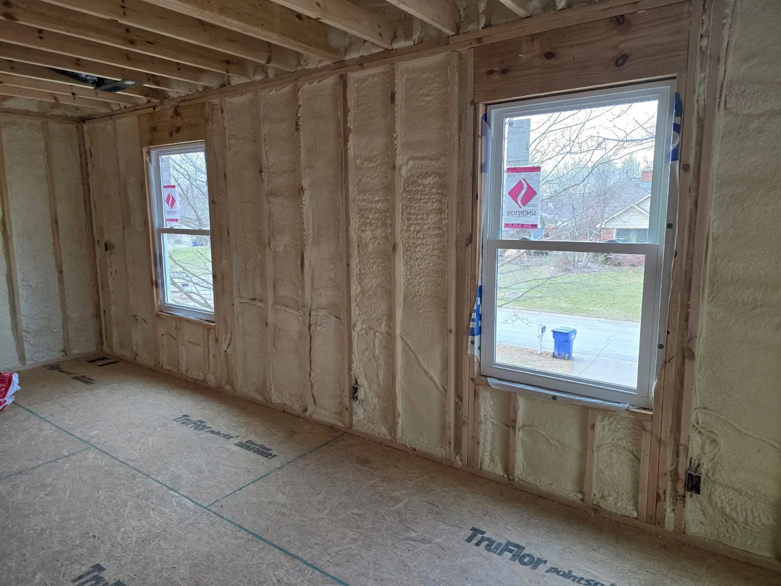 Exterior wall spray foam between two windows