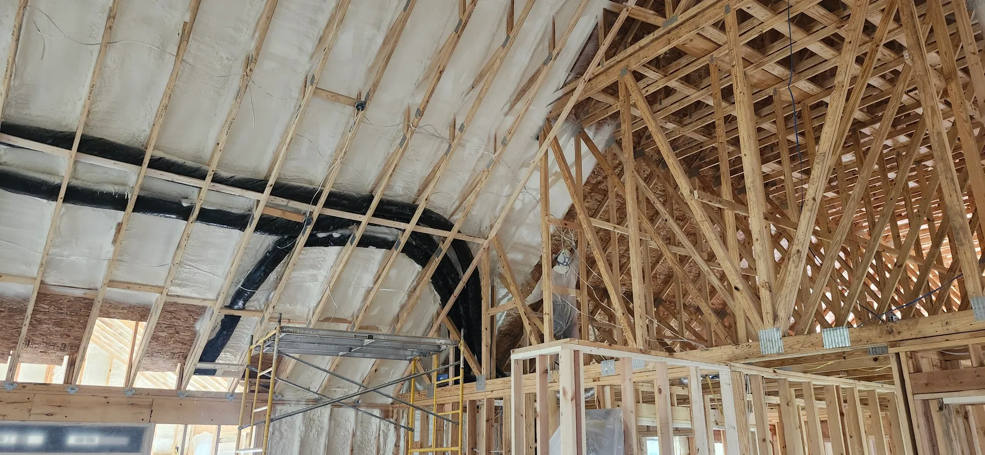 Residential roof deck with spray foam insulation
