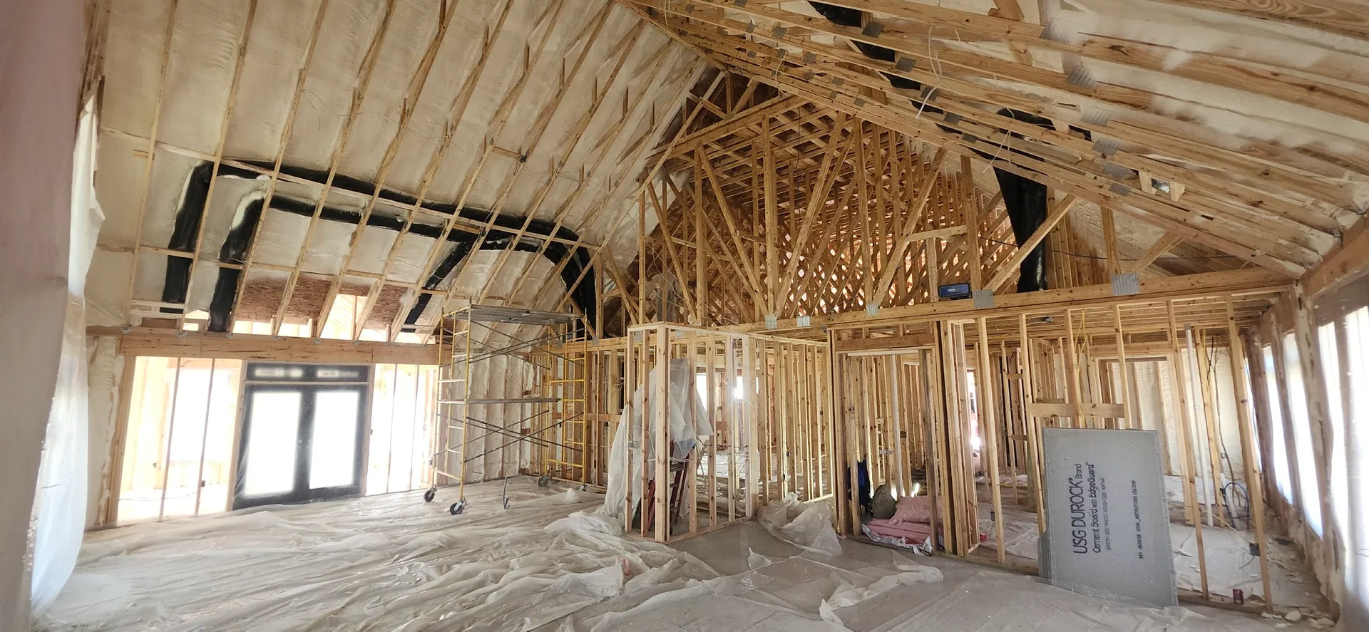 Residential vaulted ceiling framing with spray foam in new construction