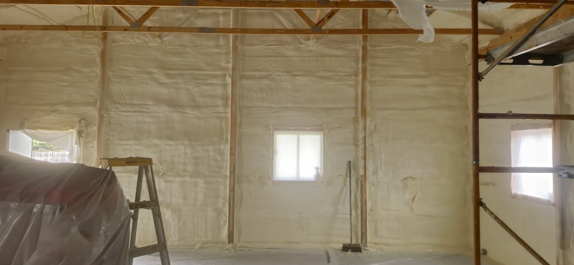 Completed residential wall insulation around window